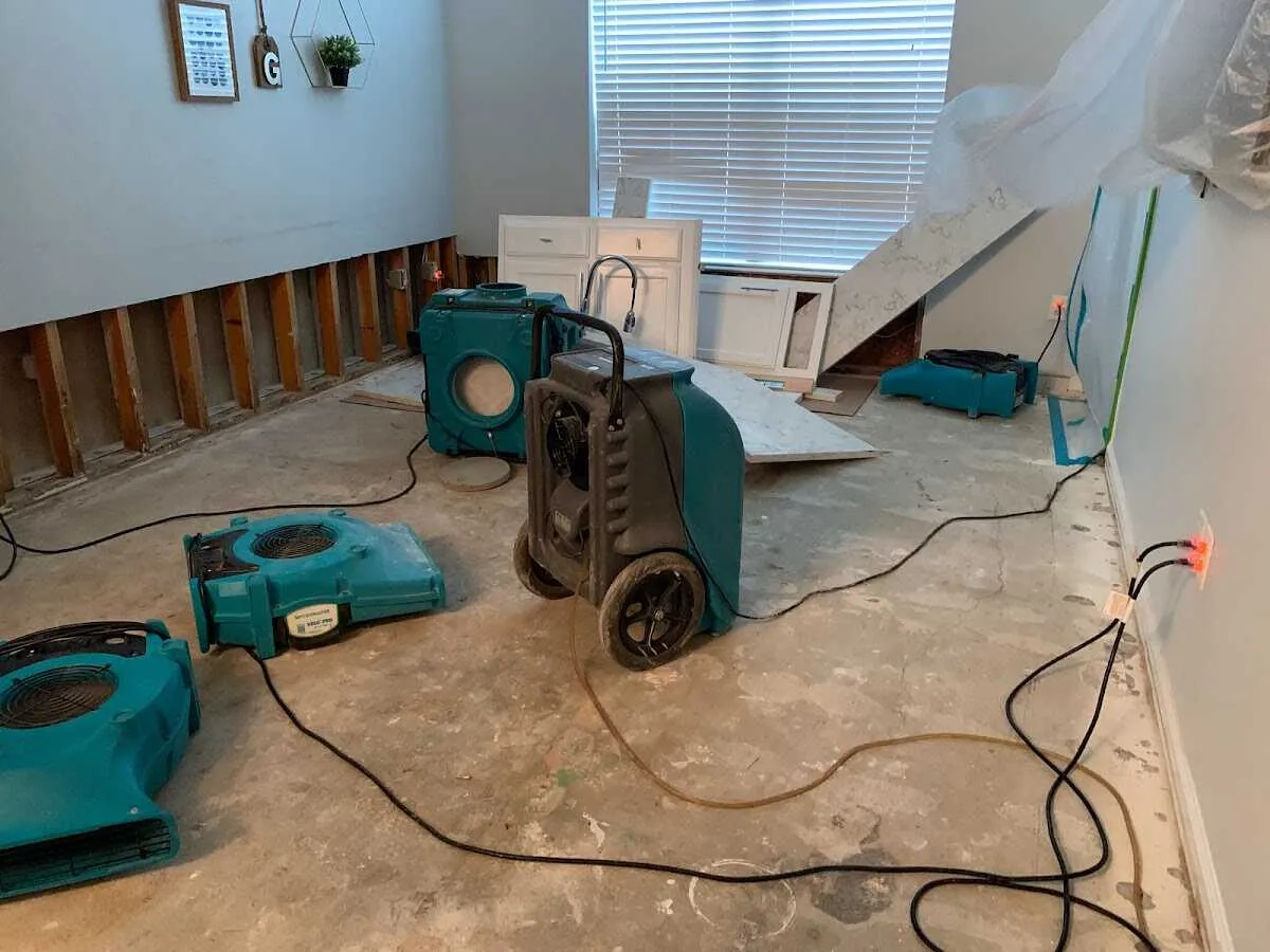 Dehumidifier in flood-cut room for Water Damage Restoration in Cypress