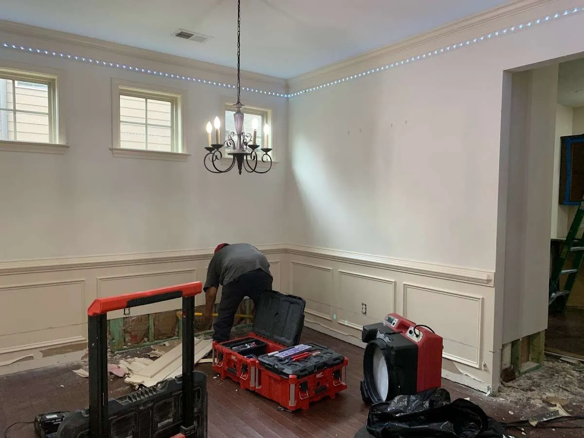 Restoration technician with professional equipment in Cypress